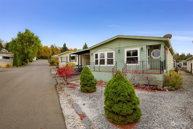 view of front of home with a carport