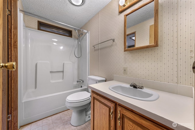 full bathroom featuring vanity, tile patterned floors, shower / washtub combination, toilet, and a textured ceiling