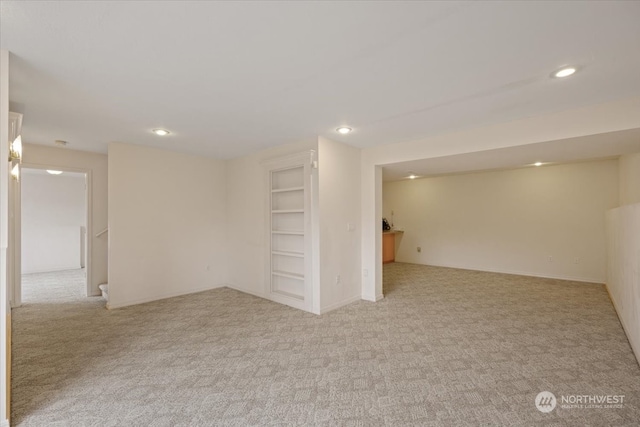 basement with light colored carpet