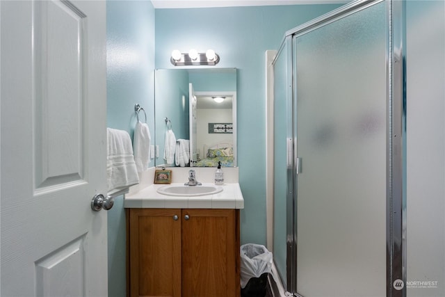 bathroom with vanity and an enclosed shower