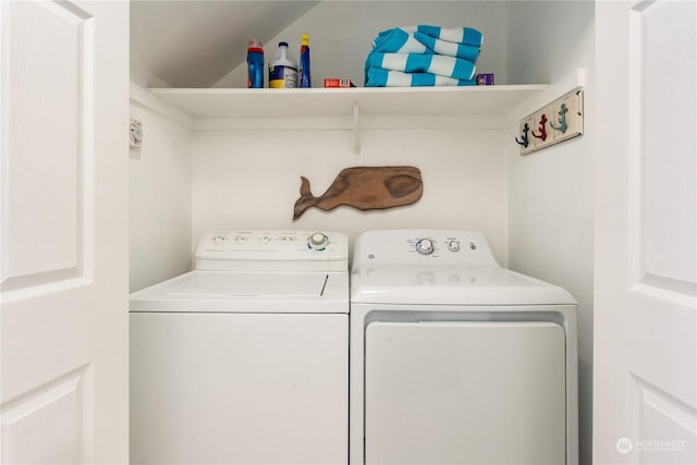 washroom with washer and dryer