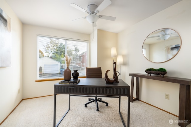 carpeted home office with ceiling fan