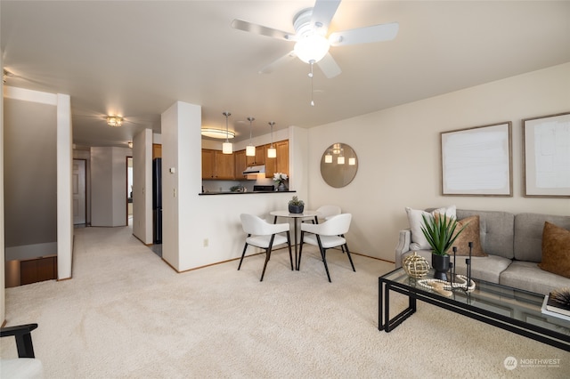 living room featuring light carpet and ceiling fan