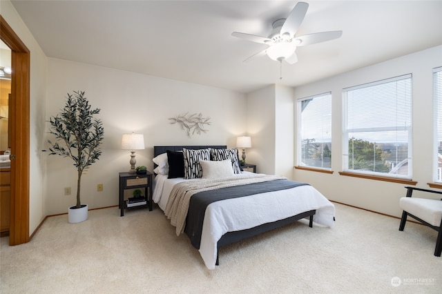 carpeted bedroom featuring ceiling fan