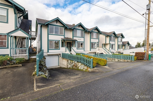 townhome / multi-family property featuring a garage