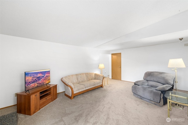 carpeted living room featuring vaulted ceiling