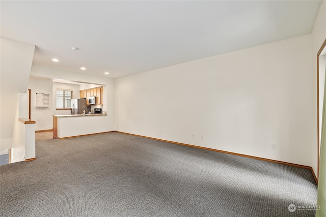 unfurnished living room with carpet