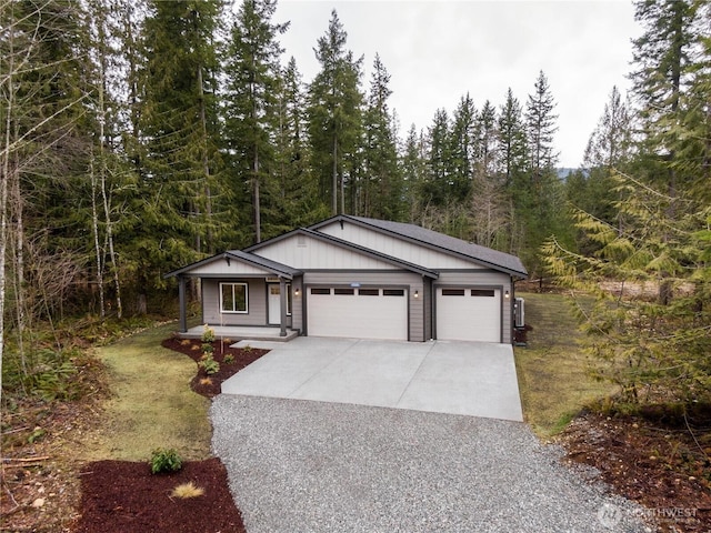 view of front of home with a garage, board and batten siding, and concrete driveway