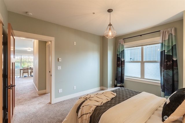 bedroom with light colored carpet