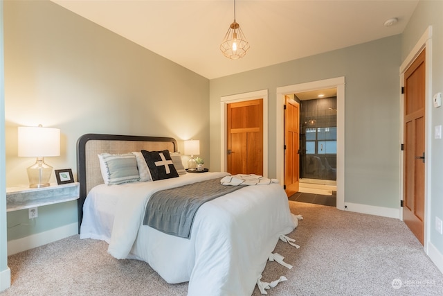 bedroom with carpet and ensuite bathroom