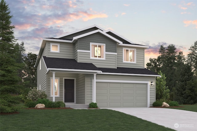 view of front facade featuring a garage and a yard