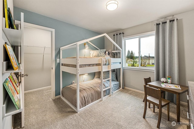 bedroom with carpet and baseboards