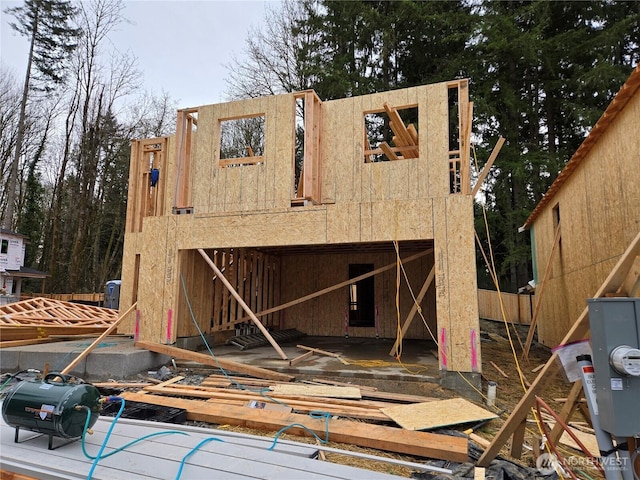 back of property featuring stucco siding