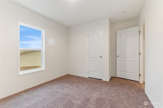 unfurnished bedroom featuring carpet floors