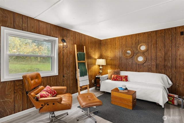 living room featuring wood walls and hardwood / wood-style flooring