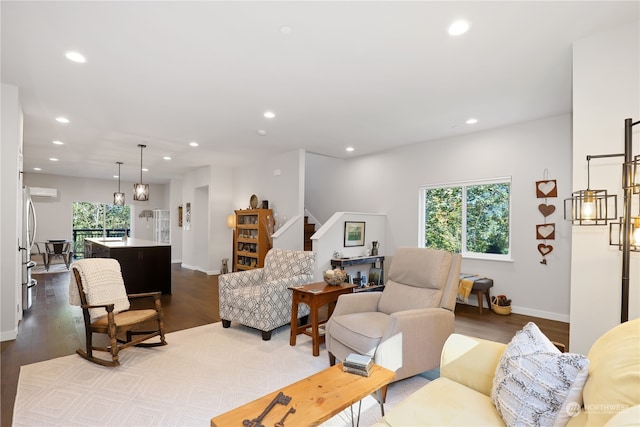 living room featuring plenty of natural light and wood-type flooring