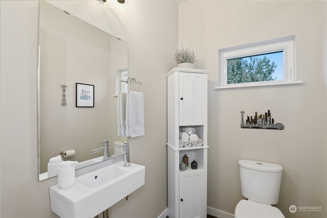 bathroom with toilet and sink