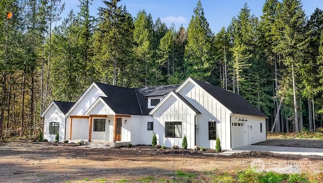 modern farmhouse style home with a garage