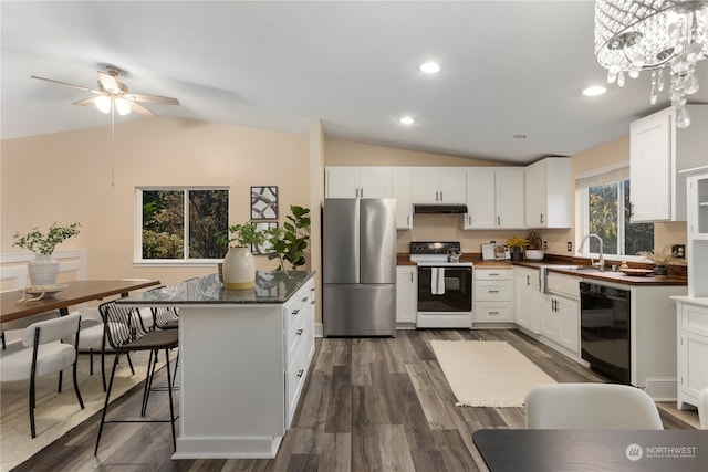 kitchen with stainless steel refrigerator, white cabinetry, dishwasher, white range with electric stovetop, and lofted ceiling