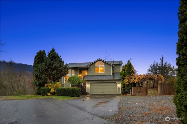 front of property with a garage