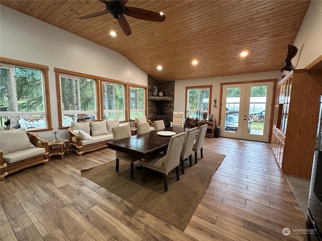 dining space featuring ceiling fan, french doors, wooden ceiling, lofted ceiling, and light wood-type flooring