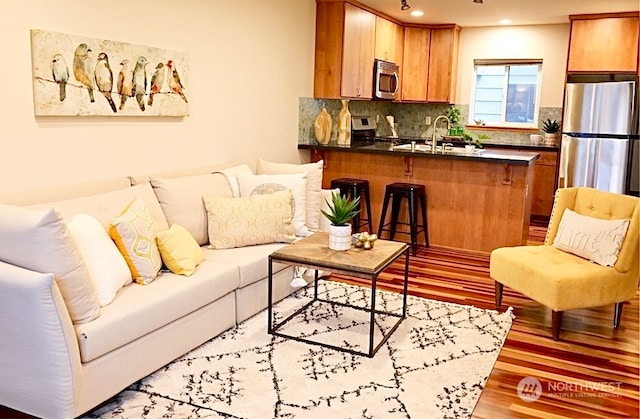 4333 9th Ave NE Unit C, Seattle, WA 98105 - living room featuring light wood-type flooring and sink