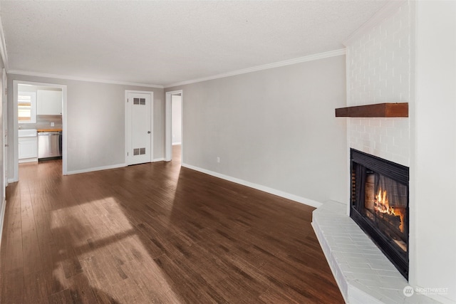 14516 Dayton Ave N, Shoreline, WA 98133 - unfurnished living room with a brick fireplace, ornamental molding, dark wood-style floors, and baseboards