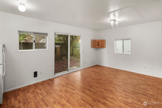 14516 Dayton Ave N, Shoreline, WA 98133 - spare room featuring light wood finished floors and baseboards
