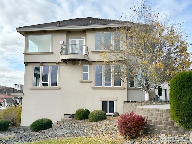 rear view of house with a balcony