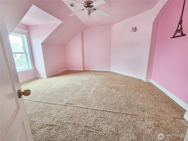 additional living space featuring ceiling fan, vaulted ceiling, and carpet