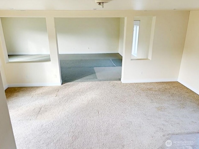 spare room with light carpet