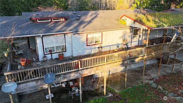 rear view of house with a deck