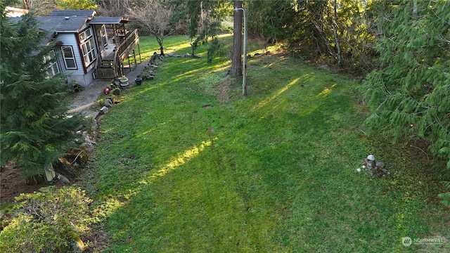 view of yard with a wooden deck