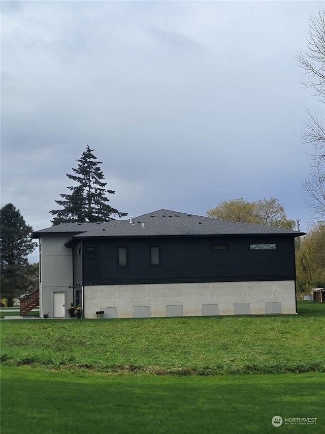 view of property exterior with a yard