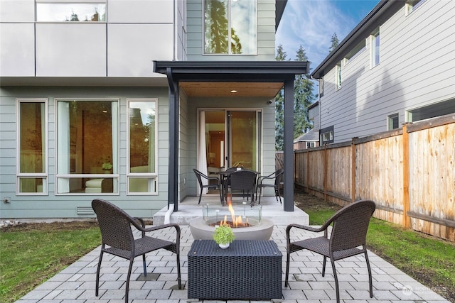 view of patio / terrace with an outdoor fire pit