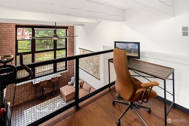 office with hardwood / wood-style floors and beamed ceiling