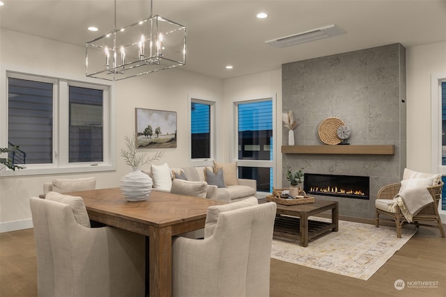 living room with a fireplace and dark wood-type flooring