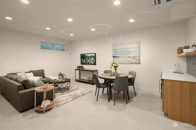 dining area with light colored carpet