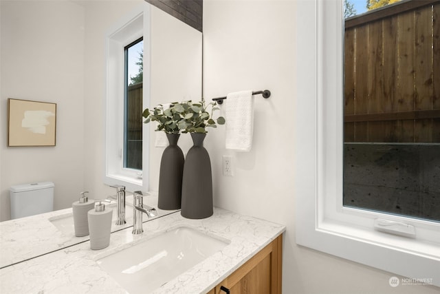 bathroom with vanity and toilet