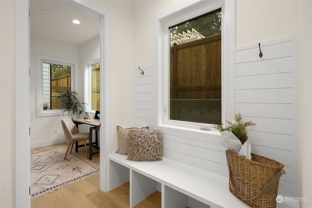 mudroom with light hardwood / wood-style floors