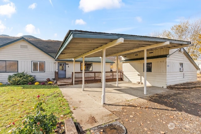 rear view of house with a carport