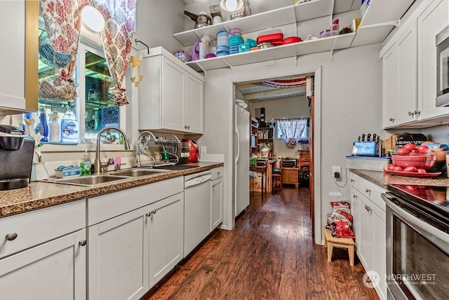 kitchen with dark hardwood / wood-style floors, white cabinetry, and appliances with stainless steel finishes