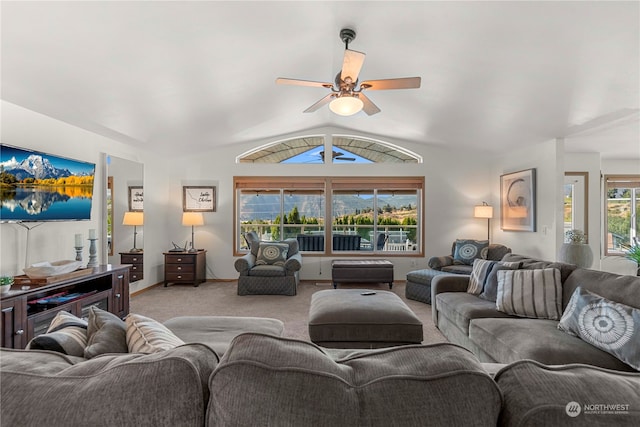 living room with light carpet, ceiling fan, and lofted ceiling