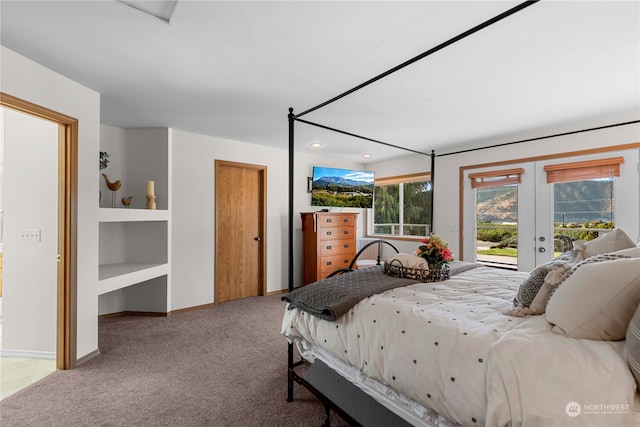 bedroom featuring access to exterior, light carpet, and french doors