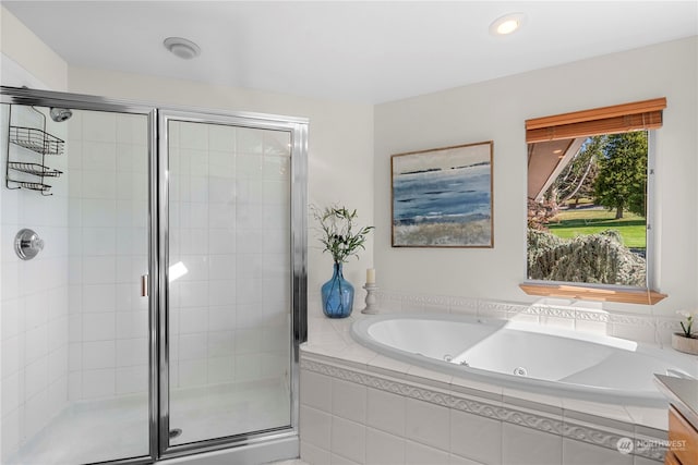 bathroom with plus walk in shower and vanity