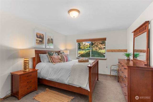 bedroom featuring light colored carpet