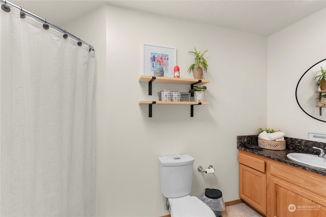 bathroom with tile patterned flooring, vanity, toilet, and a shower with shower curtain