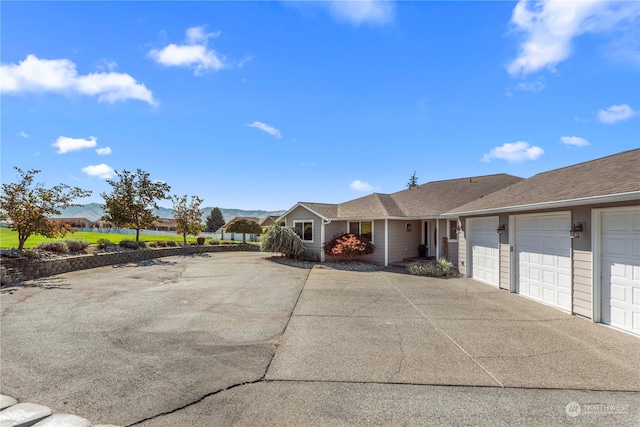 single story home with a garage