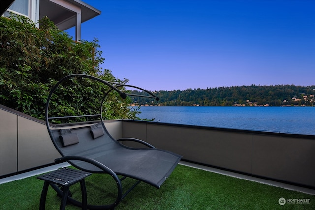 balcony featuring a water view