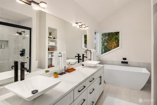 full bathroom with vanity, toilet, independent shower and bath, and vaulted ceiling